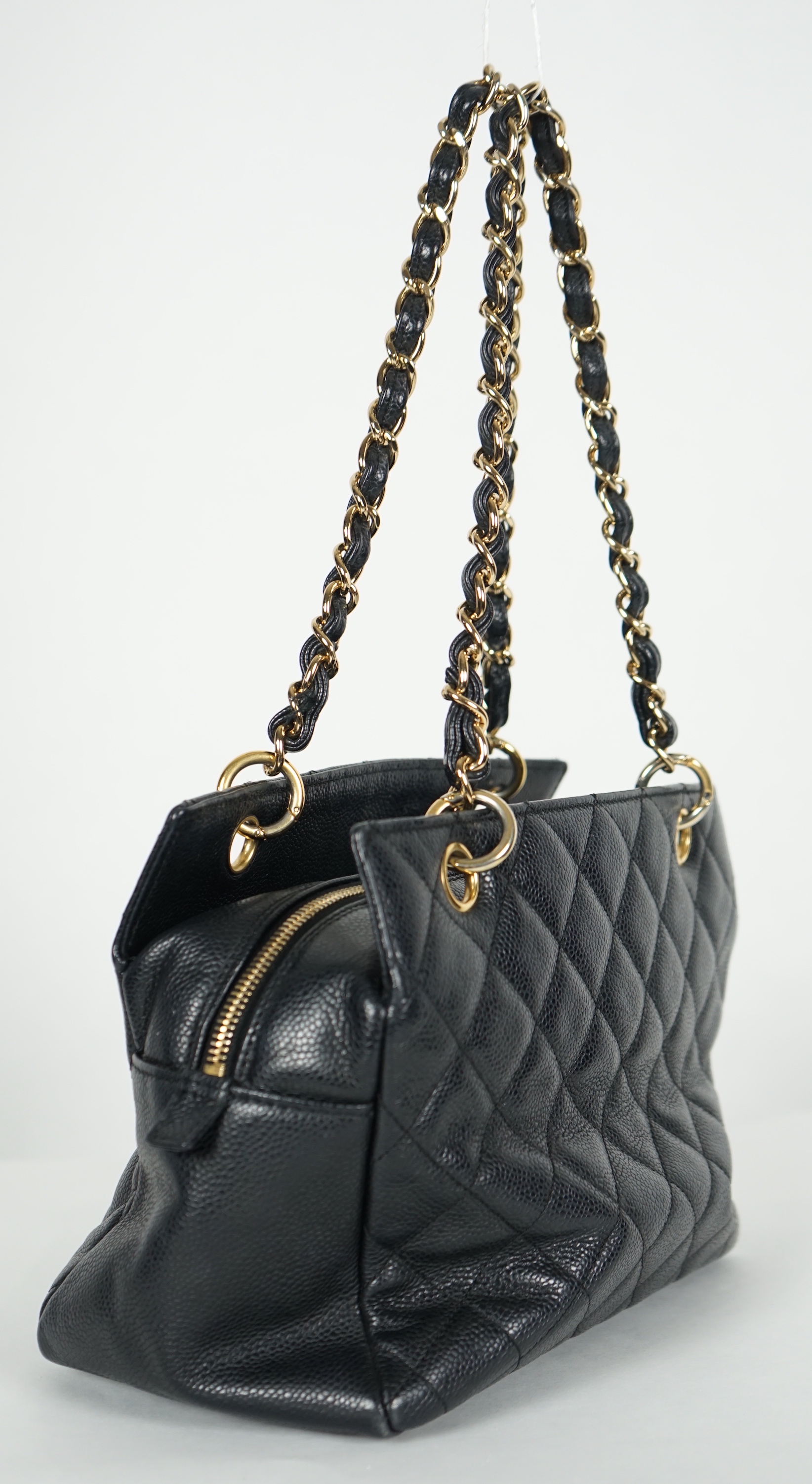 A Chanel Classic Petit Timeless Tote in black caviar with gold hardware, width 26cm, height 19cm, height overall 41cm, depth 13cm., Please note this lot attracts an additional import tax of 20% on the hammer price